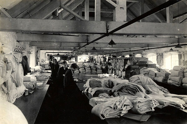 Archive photo of John Smedley factory showing reams of fabric